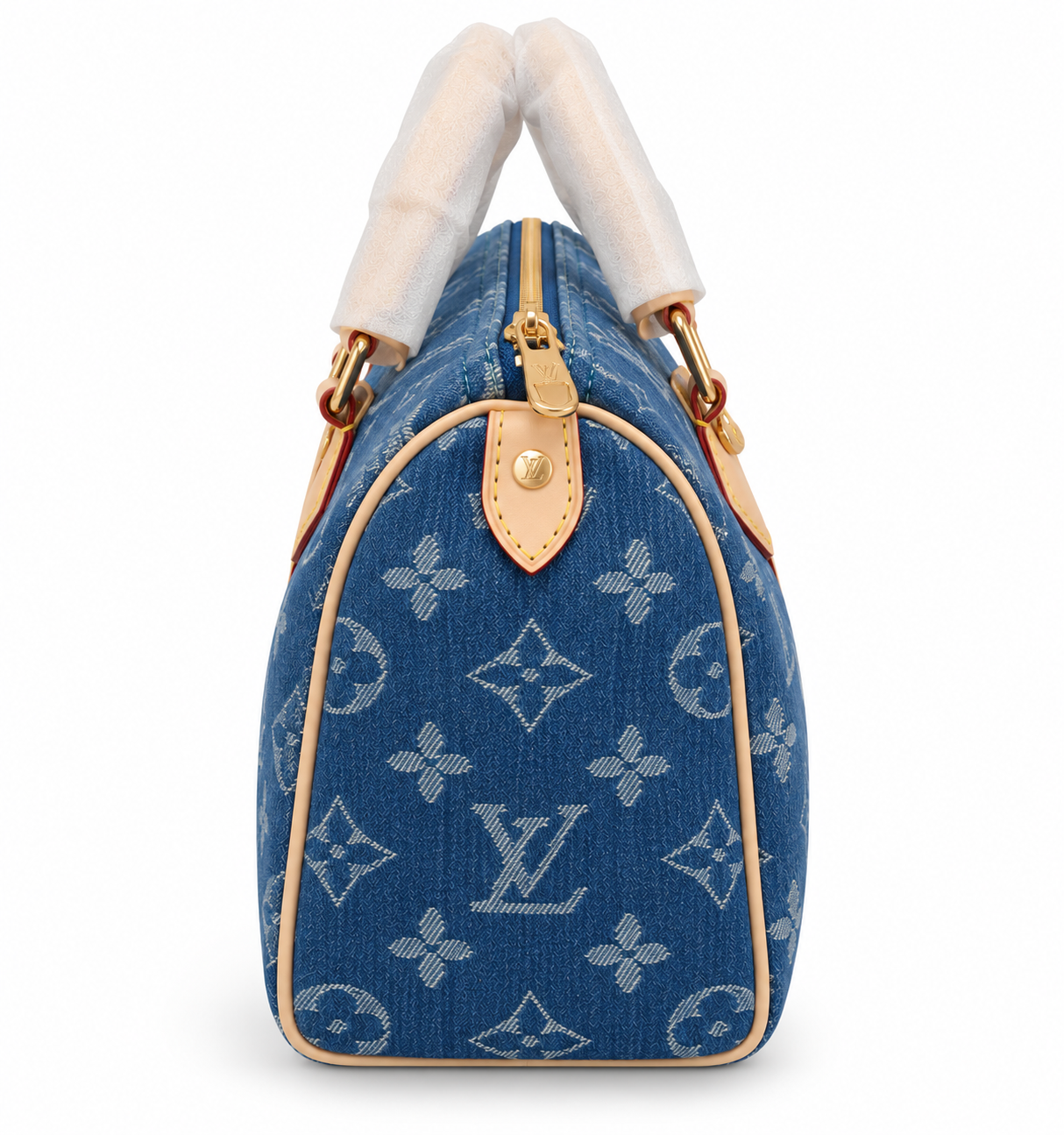 Side profile of the monogram denim Speedy 25 showing leather trim and gold zip