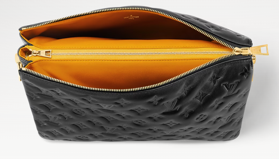 Coussin MM open from above showing the yellow lined interior and zip pocket