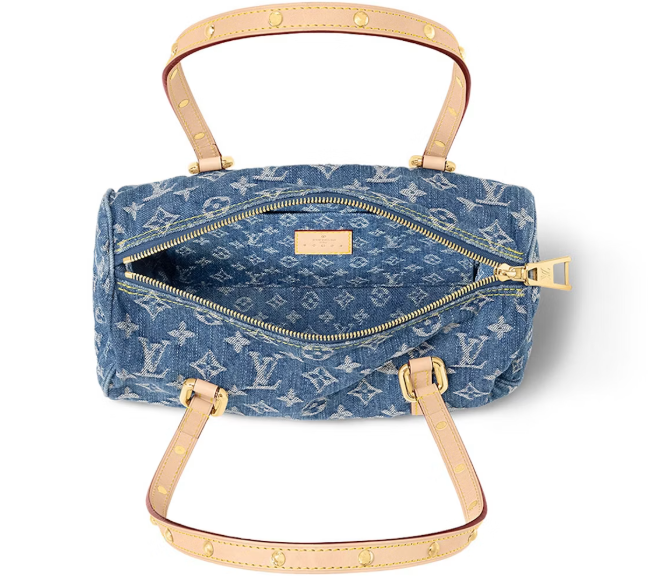 Louis Vuitton Papillon denim bag open, showing the lined interior